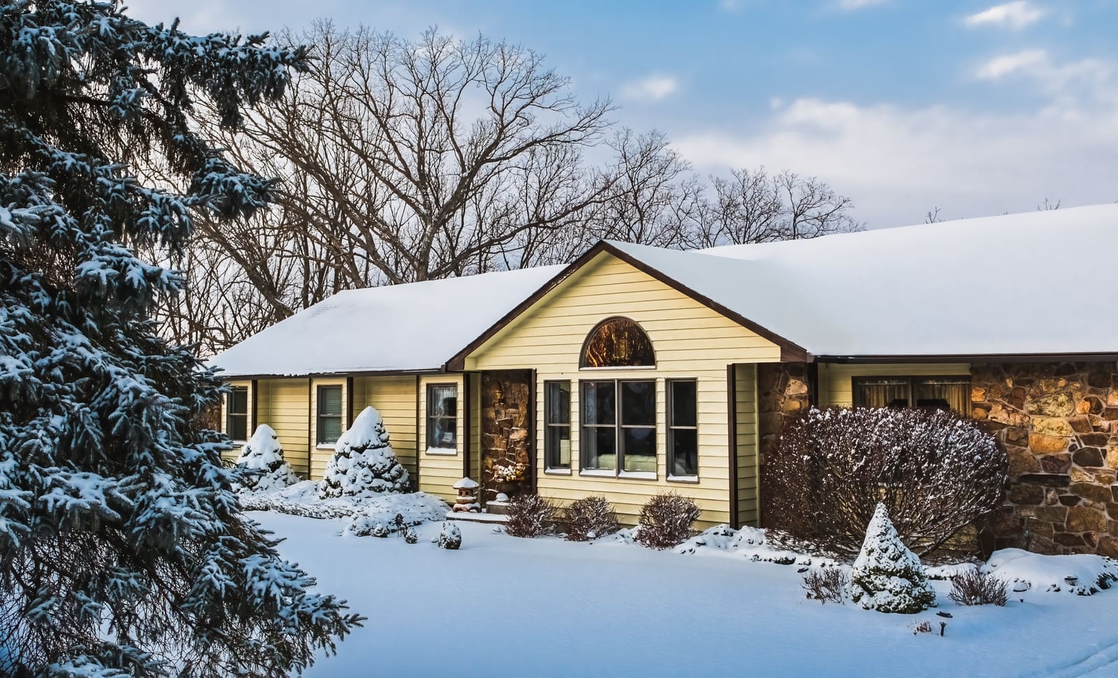 Suburban house exterior in winter after snowstorm
